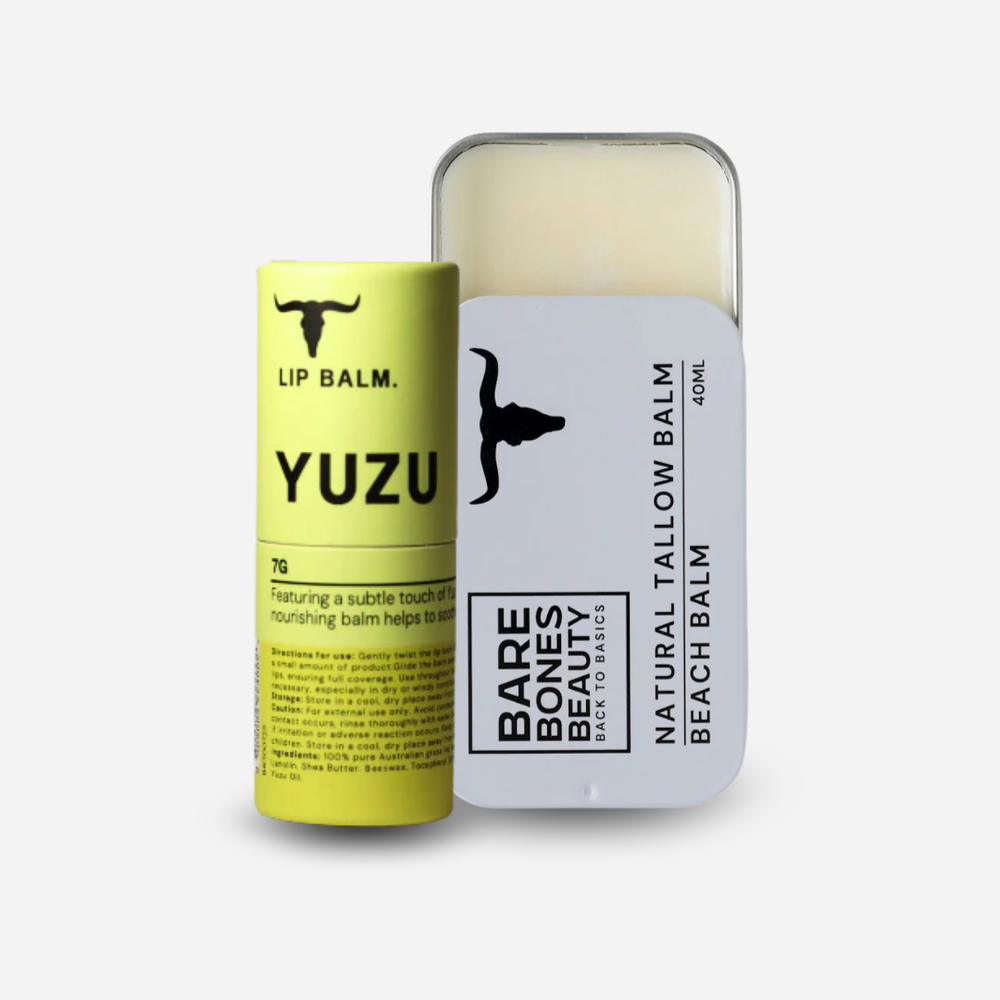 
                  
                    A Bare Bones Beauty Australia Tallow Balm & Lip Balm Bundle is shown: a yellow lip balm tube stands by a rectangular tallow balm tin with its lid slightly open, revealing the natural skincare products inside.
                  
                