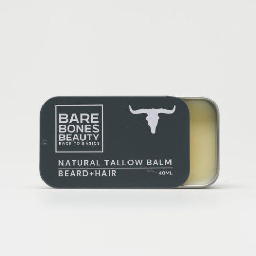 A rectangular tin of Bare Bones Beauty Australia Beard+Hair Balm, 40ml, with a sliding lid open to reveal the balm. The dark label with a bull head graphic highlights this natural beard and hair moisturizer.