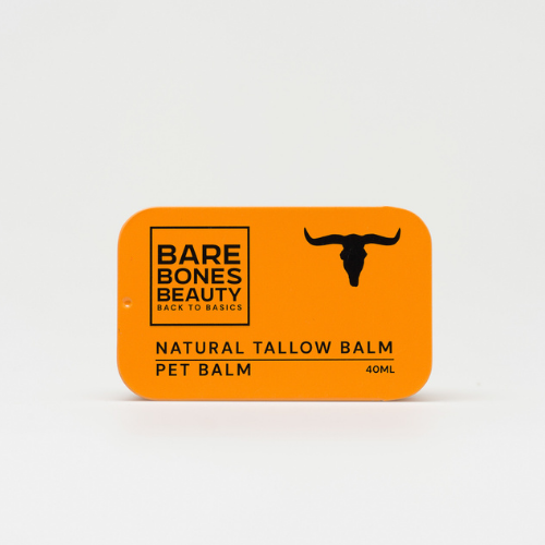 A rectangular orange tin labeled "Pet Balm" by Bare Bones Beauty Australia, featuring a black longhorn skull on a white background—ideal for soothing your pet's cracked pads.