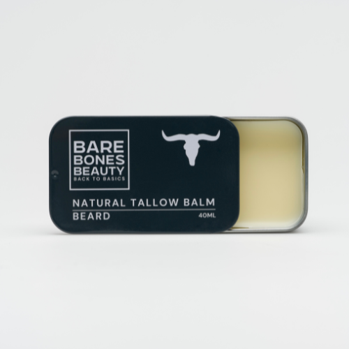 A partially open black tin of Bare Bones Beauty Australia Beard Balm - Vintage Tin reveals the light-colored balm inside, with white text and a bull head logo, emphasizing this natural beard moisturizer.