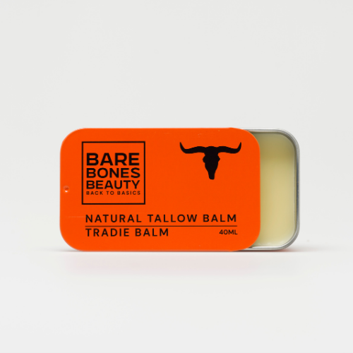 A rectangular tin of Bare Bones Beauty Australia Tradie Balm with an orange bull head lid is partly open to reveal hydrating balm for cracked skin repair, displayed on a white background.