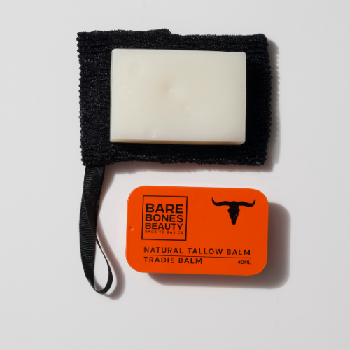 A white rectangular tallow soap and an orange tin of Bare Bones Beauty Australia’s Tallow Balm rest on a black textured cloth—discover the Soap & Balm Bundle, ideal for those seeking premium natural skincare.