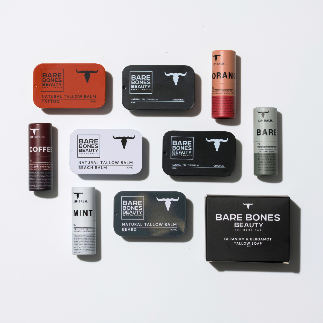 The EVERY SINGLE BONE – Bundle by Bare Bones Beauty Australia, featuring natural tallow balm tins, lip balm tubes (Tattoo, Beach Bum, Beard Balm, Coffee, Mint), and a Geranium & Bergamot tallow soap box arranged on a white surface.
