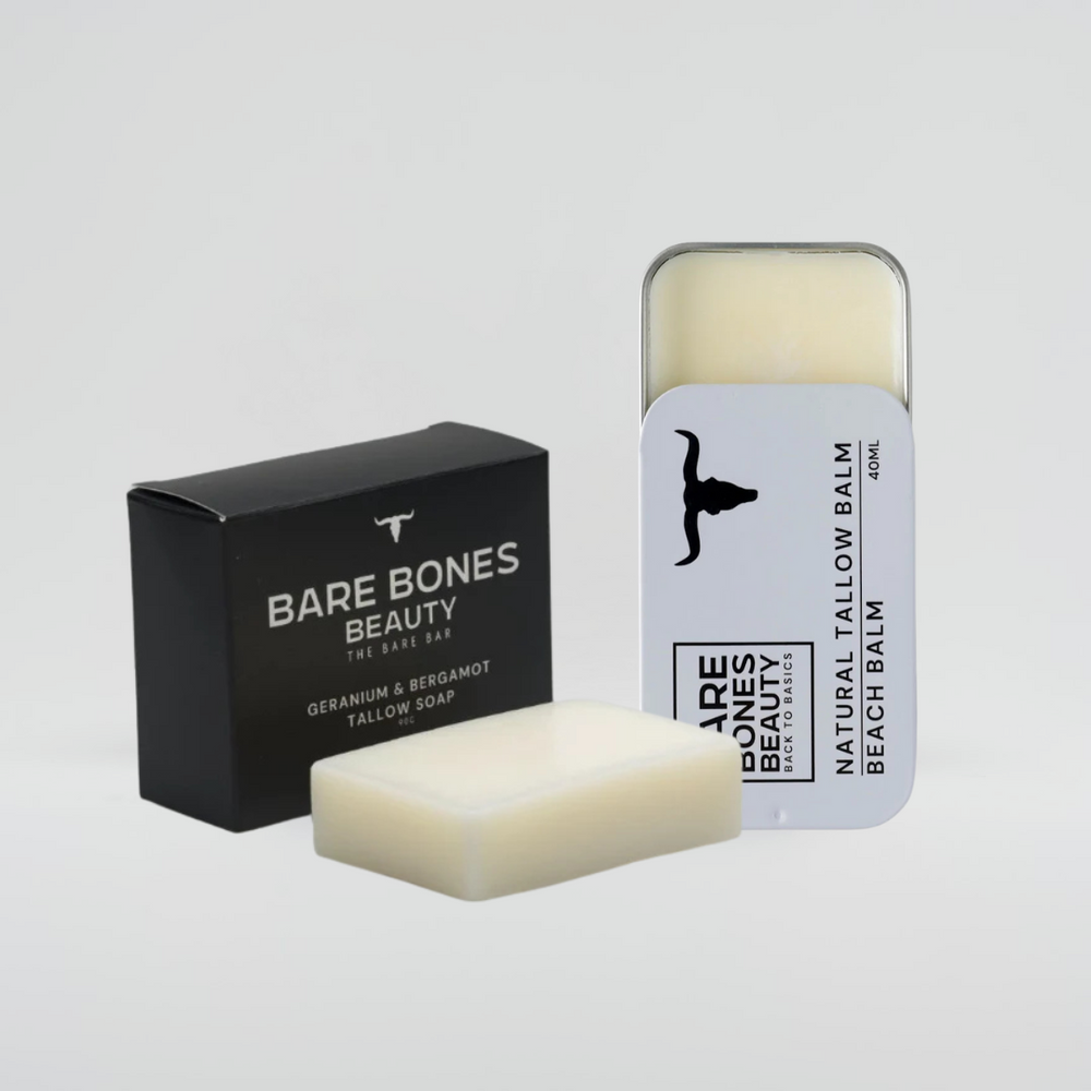 
                  
                    The Soap & Balm Bundle by Bare Bones Beauty Australia includes a black box, a white soap bar, an exfoliating bag, and a metal tin of balm featuring a black cow silhouette.
                  
                