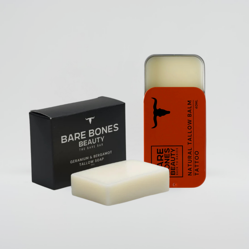 
                  
                    The Soap & Balm Bundle by Bare Bones Beauty Australia includes a tallow soap bar, an orange-labeled balm tin with cow silhouette, and a natural lip balm—essentials for your daily routine.
                  
                